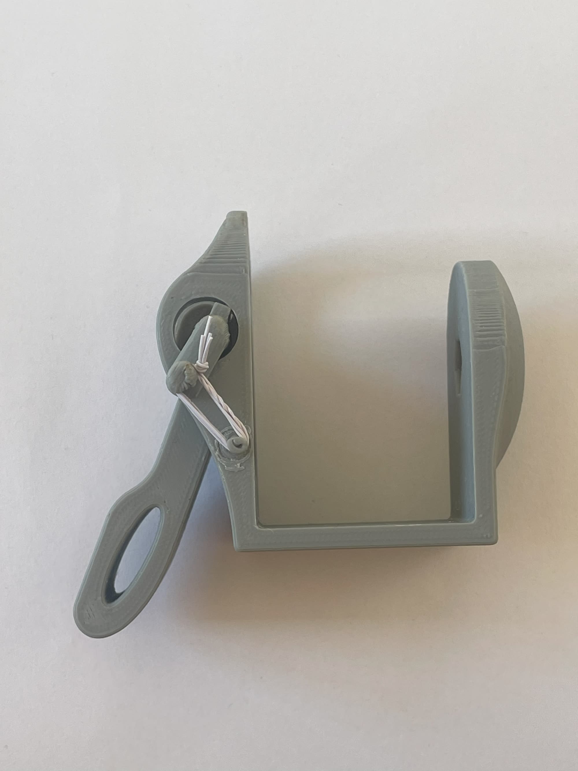 3D-printed HOLD prototype showing spring and arm