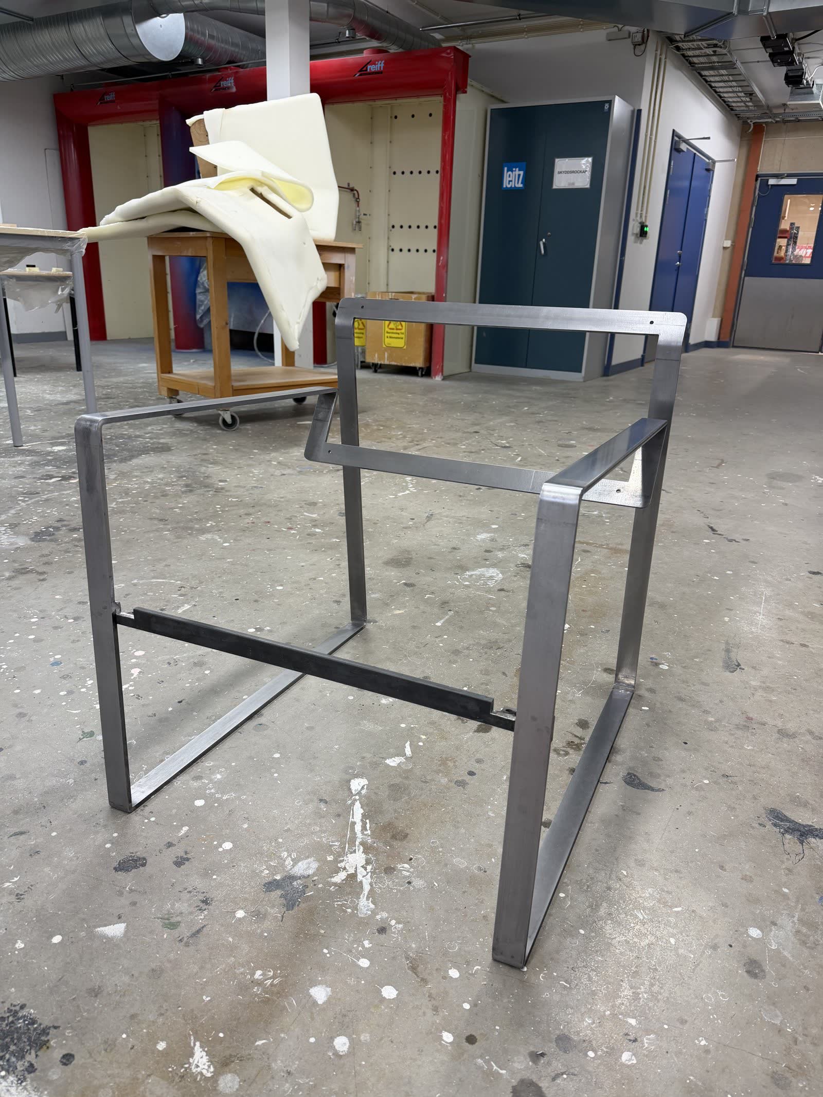 Welded steel frame standing bare before upholstery